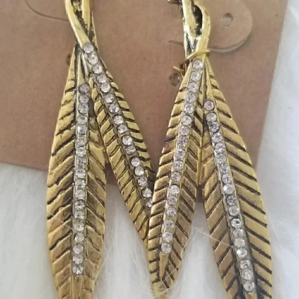 Gold toned rindstone feather earrings